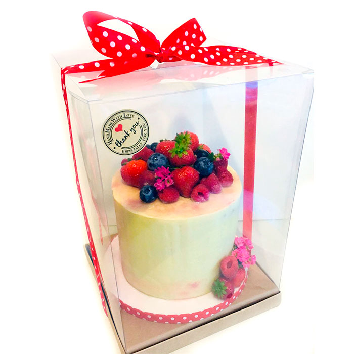Caixa de pvc transparent per pastís amb llaç vermell